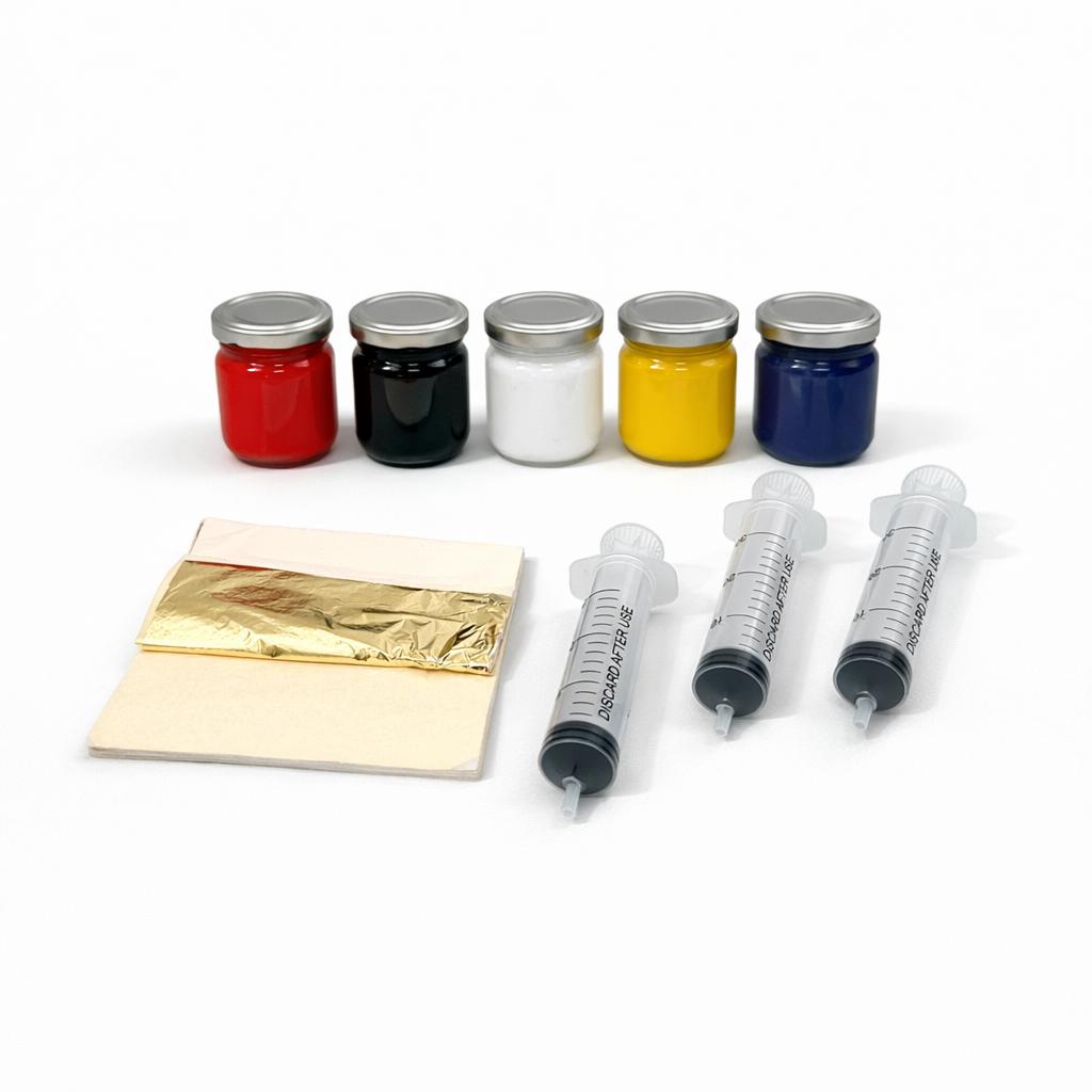 Coloranti, foglia oro, missione e siringhe del kit stucco veneziano